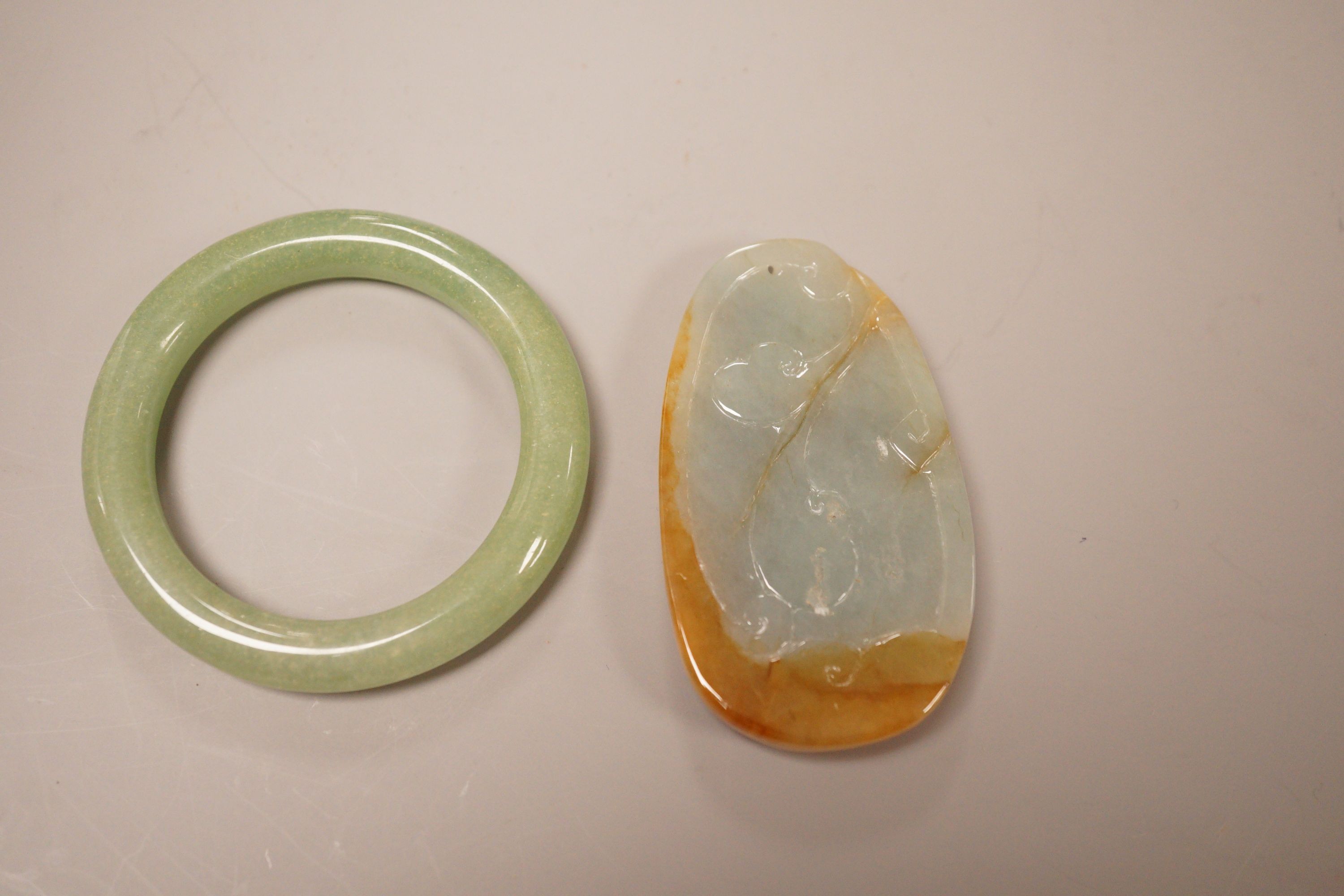 A Chinese jadeite plaque and an aventurine quartz bangle